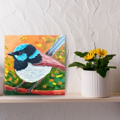 A small oil painting of a male Superb Fairywren.