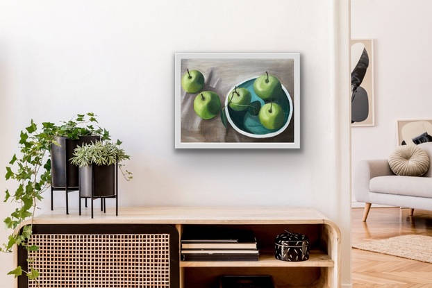 Green Apples on a blue plate and table with table cloth. Still life.