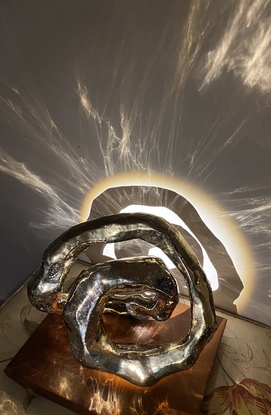 Abstract sculpture, Infinite energy, golden ring 