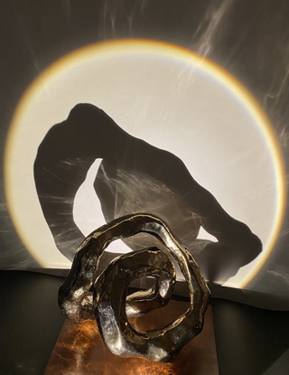 Abstract sculpture, Infinite energy, golden ring 