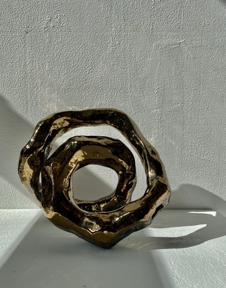 Abstract sculpture, Infinite energy, golden ring 