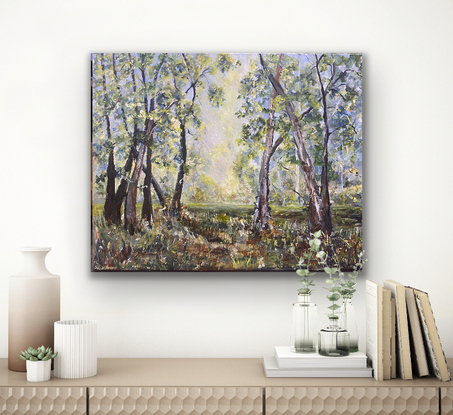 A beautiful clearing filled with golden sunlight in the break of two bands of trees. With this painting you can have your own calming piece of the Australian bush right in your room.  You can almost feel the heat of the sun, feel the crackle of the dry brush under your feet and smell the gum trees. A simple, soothing scene. 