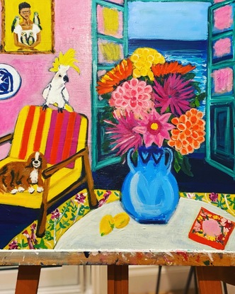 Features an open French door (inspired by Matisse) with the sea. I’ve chosen pops of vibrant colour - mainly pink, yellow and blue), a blue vase filled with Dhalia flowers sits on a coffee table, my dog, Charlie is reclining on an arm chair and a cheeky cockatoo sits atop the chair singing.