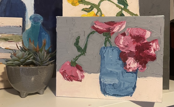 Red and pink flowers in blue pot