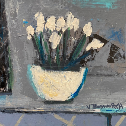 A black jug and bowl of white flowers on a grey table .  The space is flattened and the background consists of creams, and blue greys.