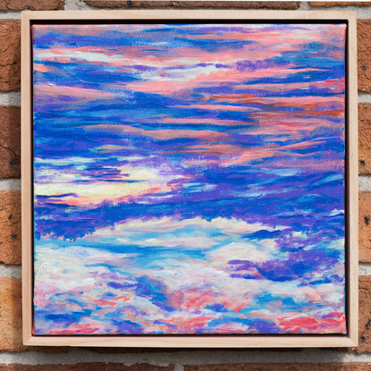 Layered colourful clouds cover the canvas with bright blue and purple tones and the occasional pop of orangey pink.