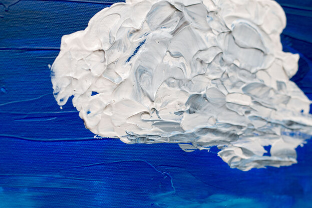 A lumpy textured white and grey blob shaped cloud floats in the centre of the canvas on a background of deep cobalt blue that has been applied with a palette knife.