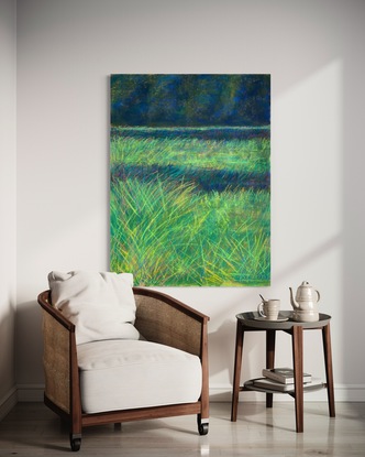 soft pastel afternoon image of a field of grass with trees in background 