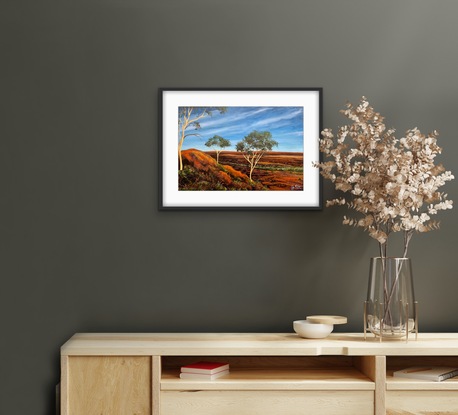 Outback hill with three gumtrees and rugged country scenery 