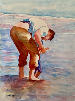 Father and son play at the water's edge.