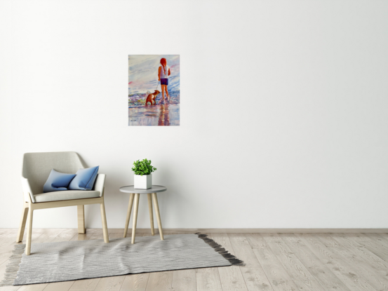 Girl stands with her dog looking out to sea.