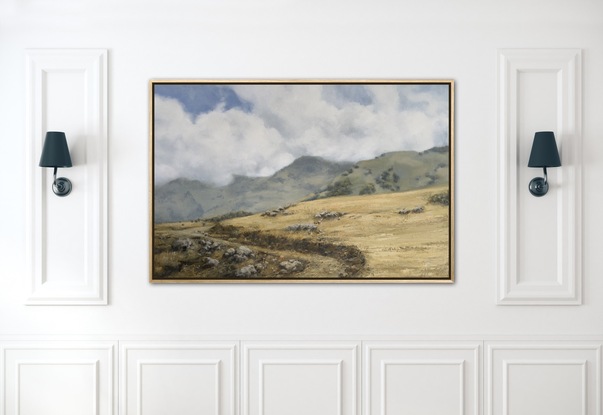 Wheat coloured grassy fields with billowing white fluffy clouds.