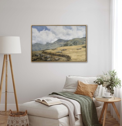 Wheat coloured grassy fields with billowing white fluffy clouds.