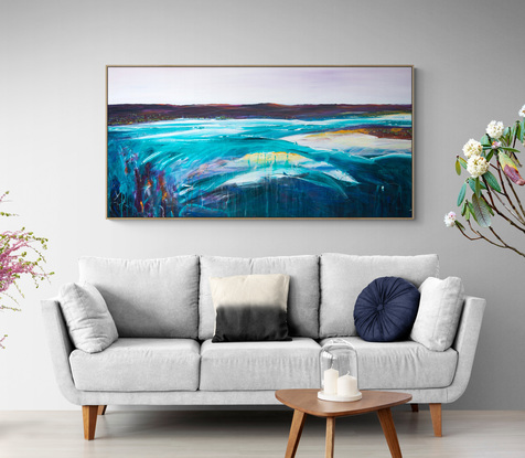 Colourful abstract seascape  with rocky mountain outcrop, blue sky, rolling countryside and crisp blue water with texture and mark making.
