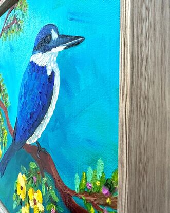 An oil painting of a blue Kingfisher bird amongst yellow Jacaranda flowers.