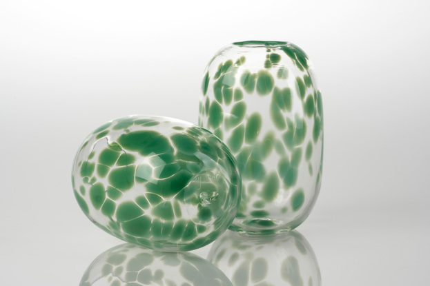 Tall, rounded clear glass vase with opaque green spots