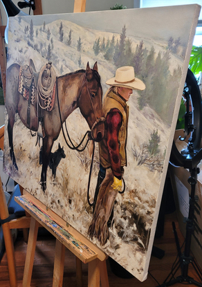 A young cowboy is looking at his beloved snowland