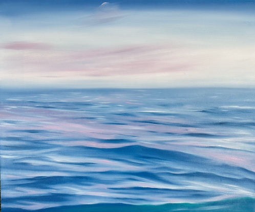 Ocean ripples looking under a pink and blue sky