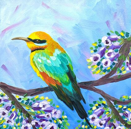 A bright Rainbow Bee-eater amongst Jacaranda flowers.