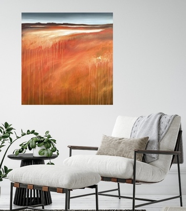 A square abstract landscape in shades of red,red gold and white dripping paint featuring a small mountainscape at the top under a blue and cloudy sky.