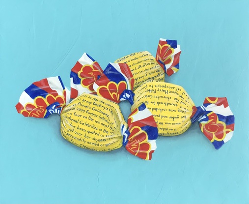 Three Fantale wrapped confectionary on a blue background.