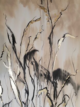 A large abstract landscape of grass and flowers in the outback in brown, beige and black with gold leaf.