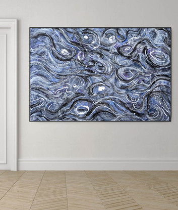 An abstract of water ripples and waves with metallic silver leaf