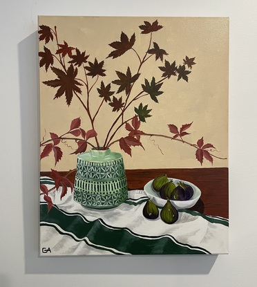 Autumn leaves in green vase