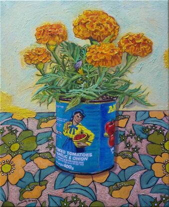 Marigold flowers in a tomato tin with patterned background