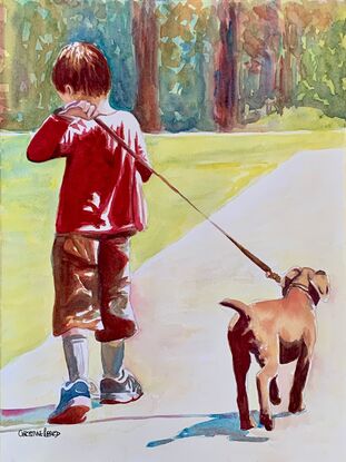 Boys walks home with his dog.
