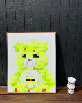 Neon lime green pixelated teddy bear sitting on a white background