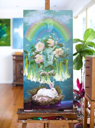 Nature spirits as rainbow and plants with white rabbit