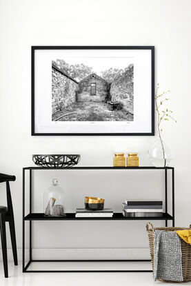 abandoned pioneers hut in rural farm setting