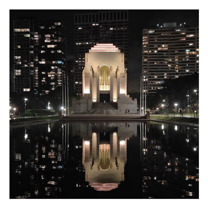 Anzac Memorial at night with lights reflecting