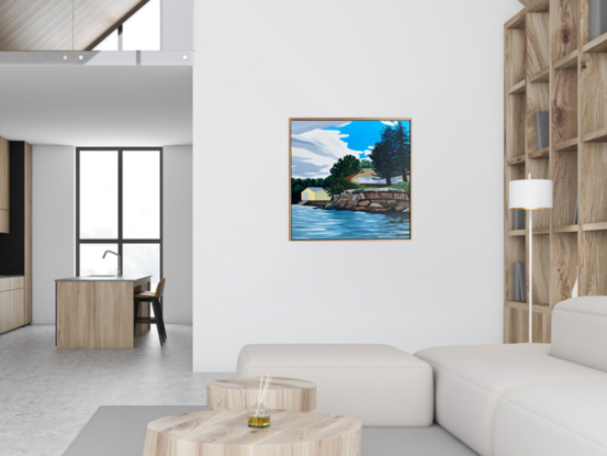 The view is from the water looking towards the house and boatshed on the river bank. There is a rock wall between the water and land and large trees obscuring the house. 