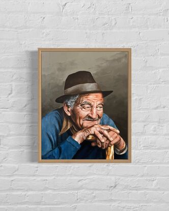 Old man in a hat with a walking stick