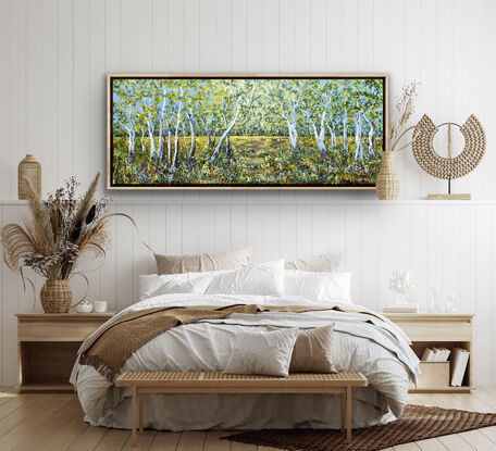 An impressionist landscape of a group of ghost gums against the yellowy wheaten grass and the Australian blue sky. The gums stand in a row so tall and proud with their hints of sienna brown and grey and white on their tall trunks soaring into the sky. A snapshot of the Australian bush in all its natural beauty and summer colours. 