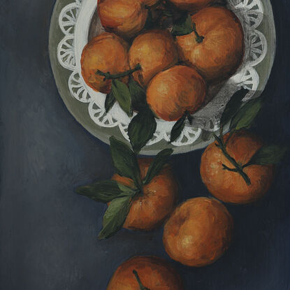 Painting of still life tangerines in a green patterned frame.