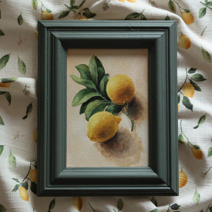 Still life of lemon branch with leaves and lemons.