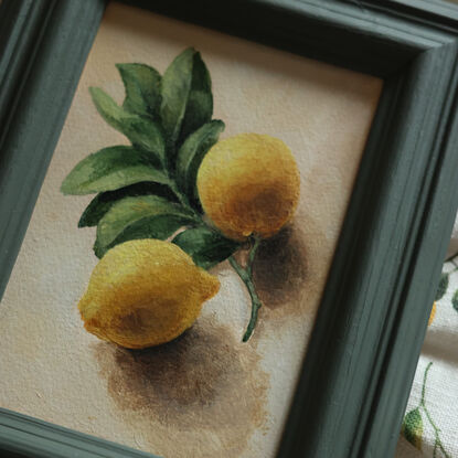 Still life of lemon branch with leaves and lemons.