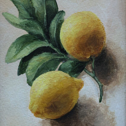 Still life of lemon branch with leaves and lemons.