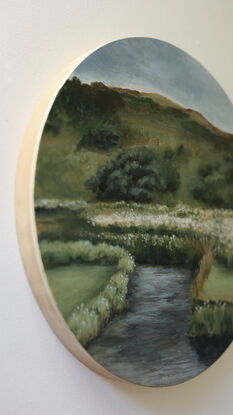 Painting of riverbank with little white wildflowers and hills in the background.