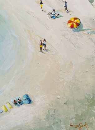 People on the beach. Colourful bathing boxes, beach umbrellas and three kayakers. Aerial view of an Australian beach.