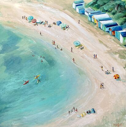 People on the beach. Colourful bathing boxes, beach umbrellas and three kayakers. Aerial view of an Australian beach.