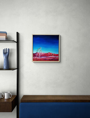 Australian landscape in blues and reds with white ghost gums in the foreground