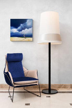 Australian landscape in blues and beige with a stormy sky and old gnarled tree