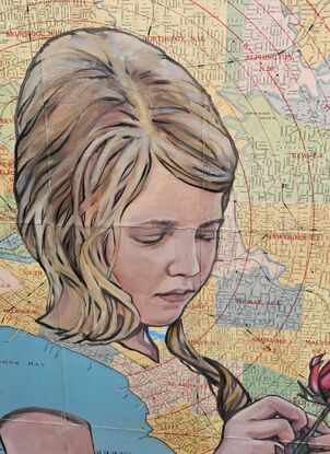 Young girl picking rose on vintage map of Melbourne Victoria. 