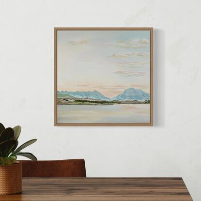 A painting of the sun setting in Queenstown with mountains and a lake in front. 