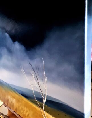 Australian landscape in blues and gold with a stormy sky and old gnarled tree, Victoria's High Country