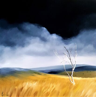 Australian landscape in blues and gold with a stormy sky and old gnarled tree, Victoria's High Country